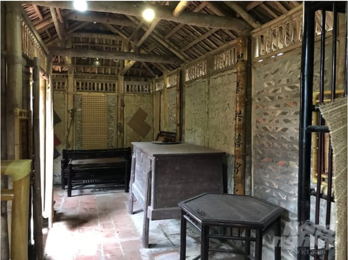 The bamboo house with earthen walls that Ky has reconstructed within the premises.