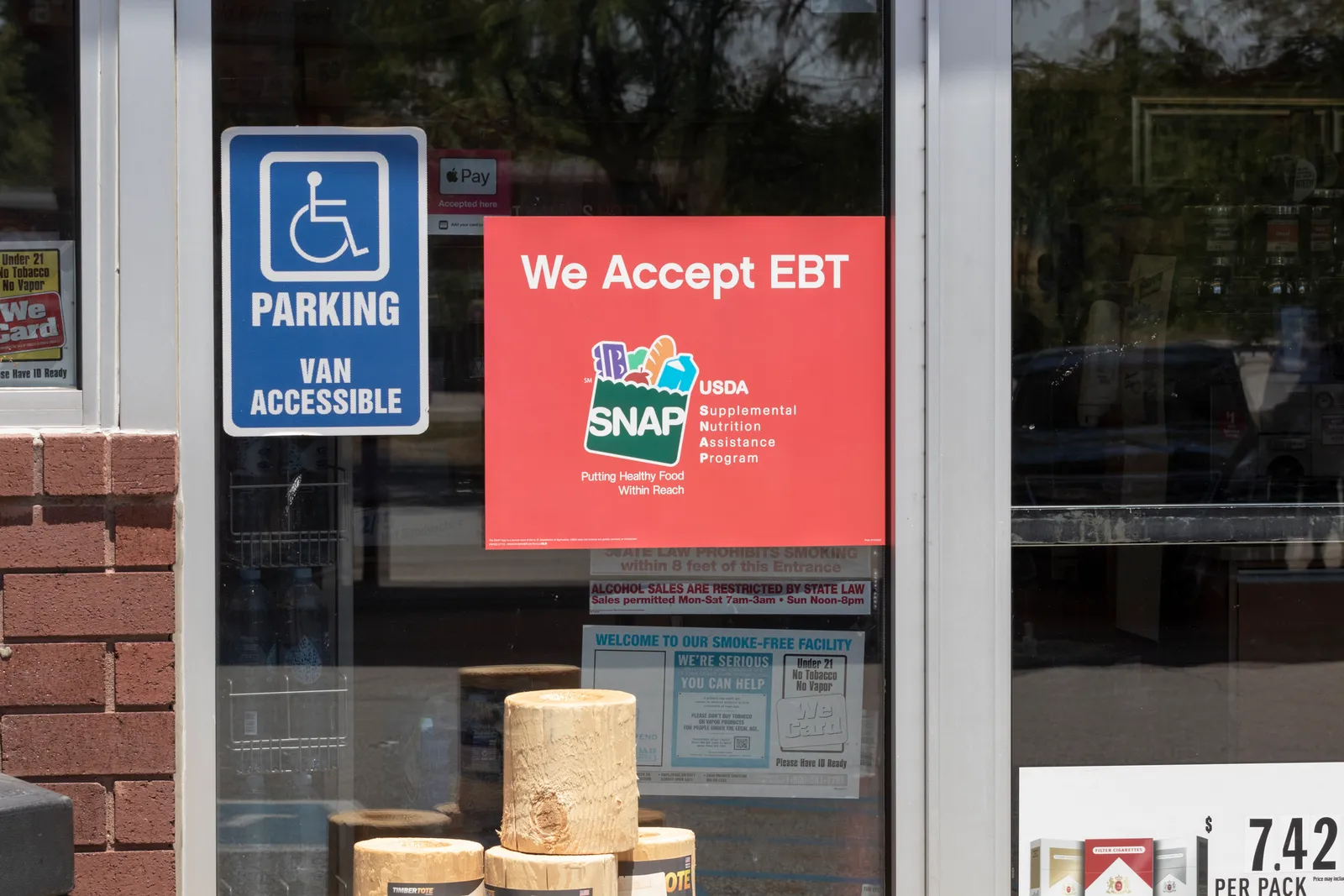 A sign about SNAP EBT outside of a store.