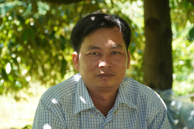 Nguyen Thanh Tam on a durian garden in Tram Chim town, Tam Nong district, Dong Thap province. Photo: Ngoc Tai