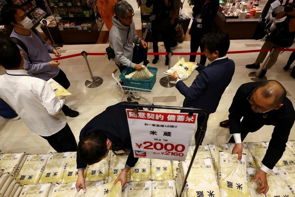 People queue up to buy government-stockpiled rice at an Ito Yokado outlet in Tokyo on Saturday. Photo: SCMP.