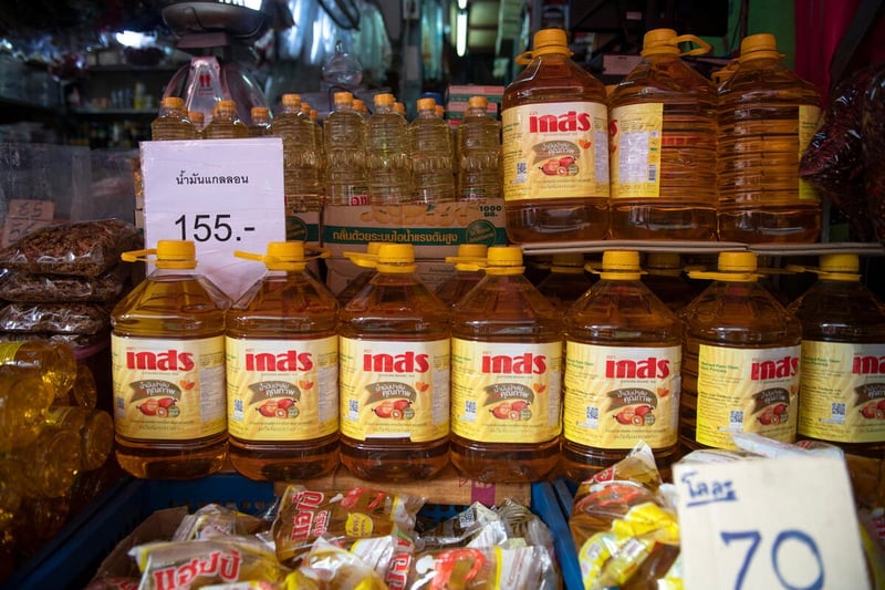 Palm and soybean oil for sale at the Klongtoey market in Bangkok, Thailand. Palm and soybean oil for sale at the Klongtoey market in Bangkok, Thailand.