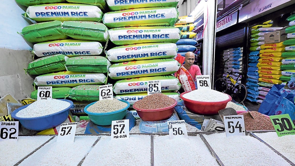 RICE WATCH Rice vendor Eddie Pascual waits for customers at his stall in the Marikina Public Market. Photo: MONTEGRANDE. RICE WATCH Rice vendor Eddie Pascual waits for customers at his stall in the Marikina Public Market. Photo: MONTEGRANDE.